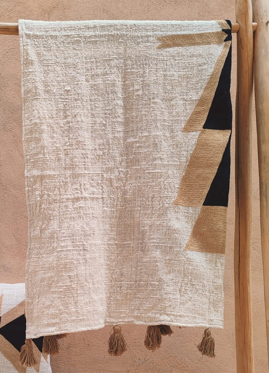 Plaid en coton brodé avec pompons